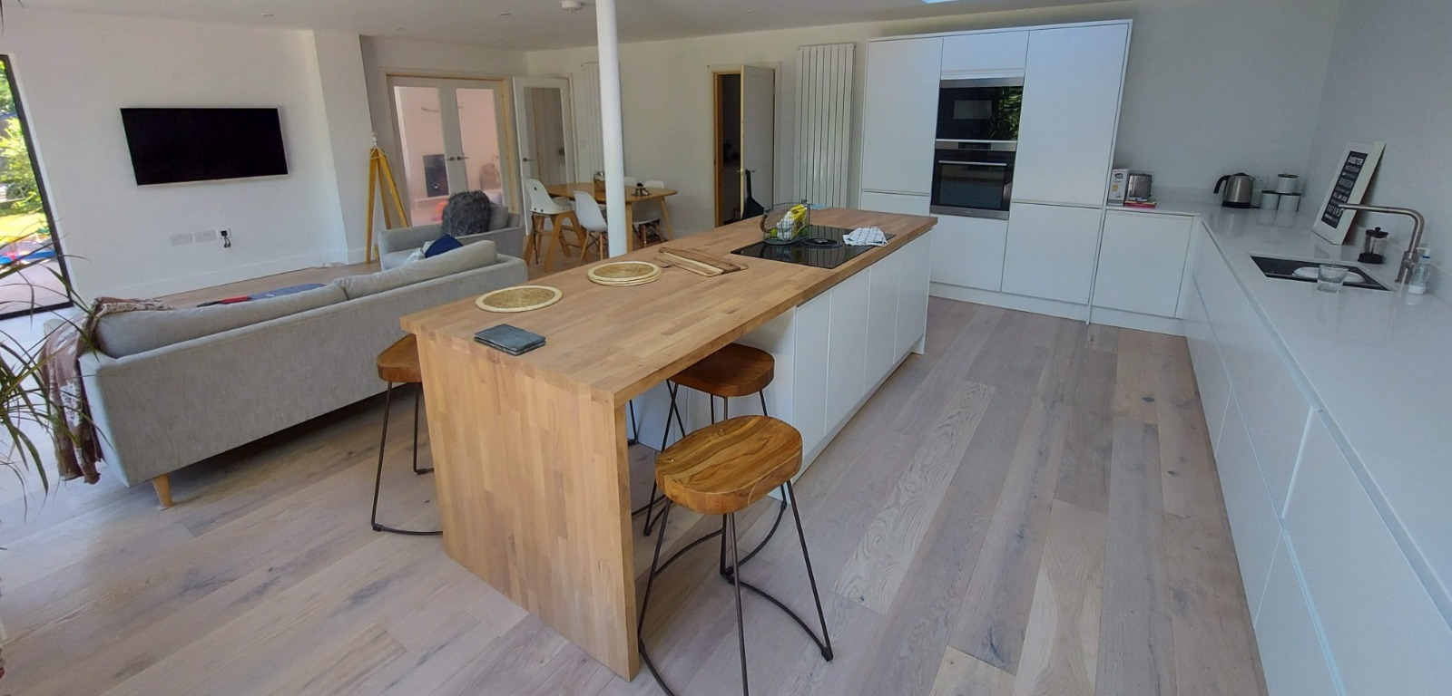 RADLEY PROJECT  large double story rear and side build, white render and dark cladding,.