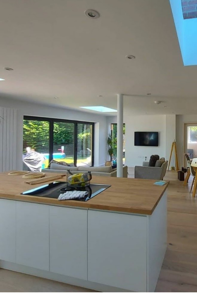 double story rear and side build, white render, dark cladding